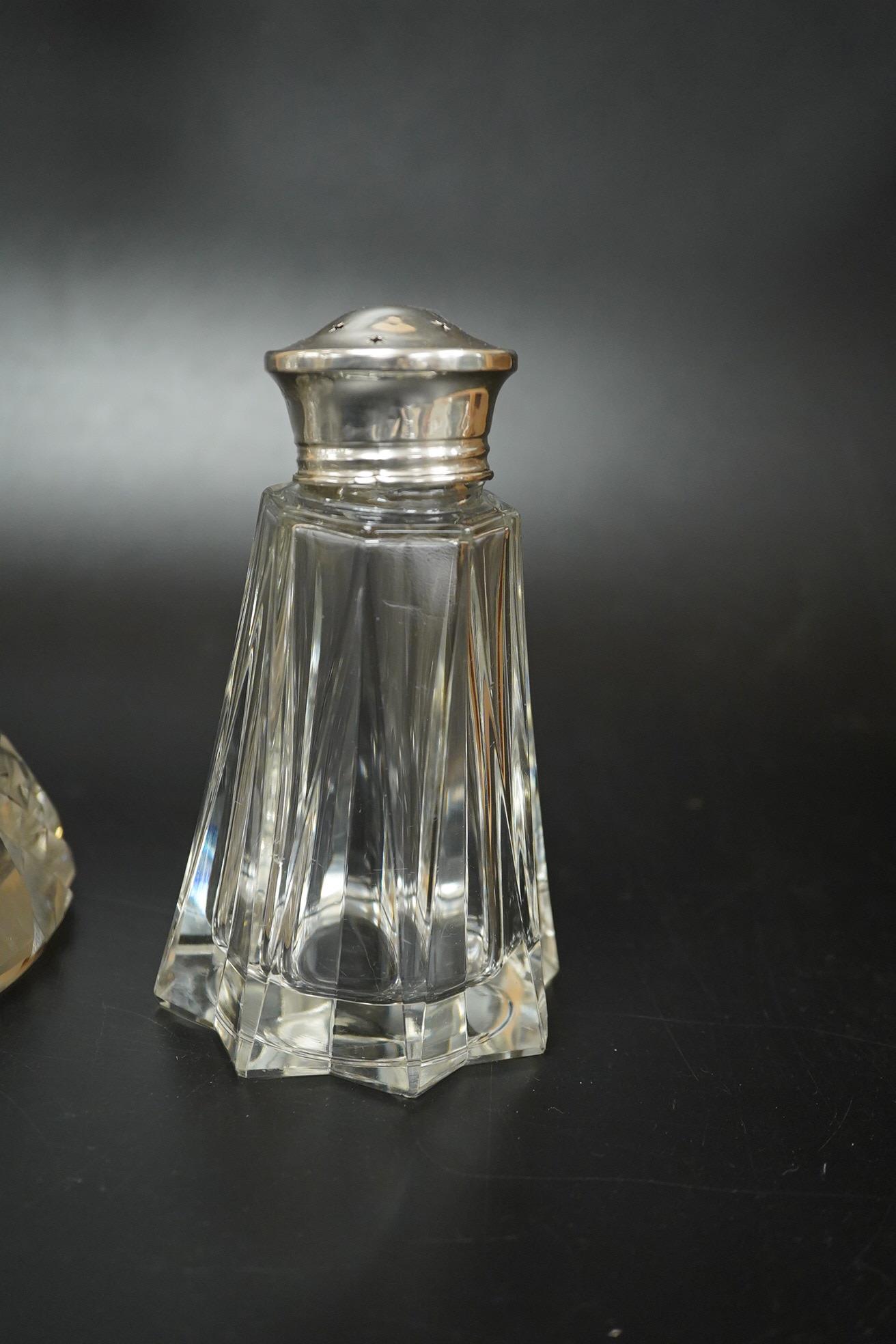 A German 800 standard white metal mounted cut glass decanter and stopper, overall height 36.5cm, together with a George VI silver mounted glass sugar caster.